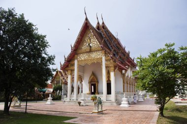 Ancient building ubosot of Wat Phra Si Rattana Mahathat temple for thai people travelers visit and respect praying blessing wish holy mystery worship buddha at Suphanburi city in Suphan Buri, Thailand