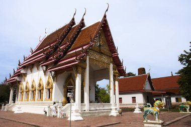 Ancient building ubosot of Wat Phra Si Rattana Mahathat temple for thai people travelers visit and respect praying blessing wish holy mystery worship buddha at Suphanburi city in Suphan Buri, Thailand