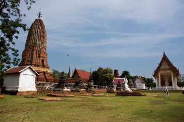 Ancient stupa ruins chedi prang of Wat Phra Si Rattana Mahathat temple for thai people travel visit and respect praying blessing wish holy mystery worship buddha at Suphanburi in Suphan Buri, Thailand