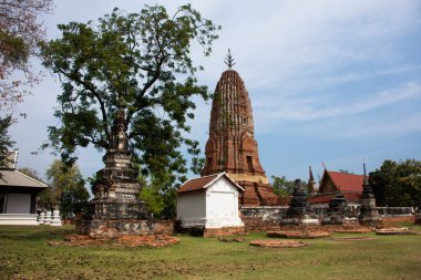 Ancient stupa ruins chedi prang of Wat Phra Si Rattana Mahathat temple for thai people travel visit and respect praying blessing wish holy mystery worship buddha at Suphanburi in Suphan Buri, Thailand