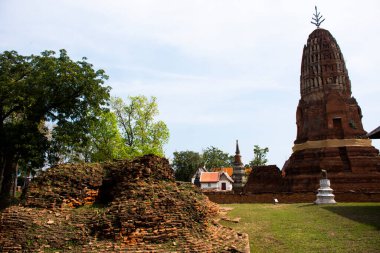 Ancient stupa ruins chedi prang of Wat Phra Si Rattana Mahathat temple for thai people travel visit and respect praying blessing wish holy mystery worship buddha at Suphanburi in Suphan Buri, Thailand