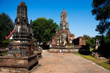 Ancient antique buddha statue and ruins old chedi stupa for thai people travel visit respect praying blessing wish holy mystery worship in Wat Choeng Tha pagoda or Koy Tha temple in Ayutthaya Thailand