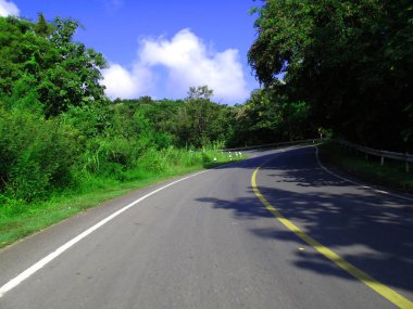 View landscape forest jungle and stree traffic road  of countryside rural at Mon Jam mountain hill for thai people drive ride bike journey and travel visit at Chiang Mai city in Chiang Mai, Thailand