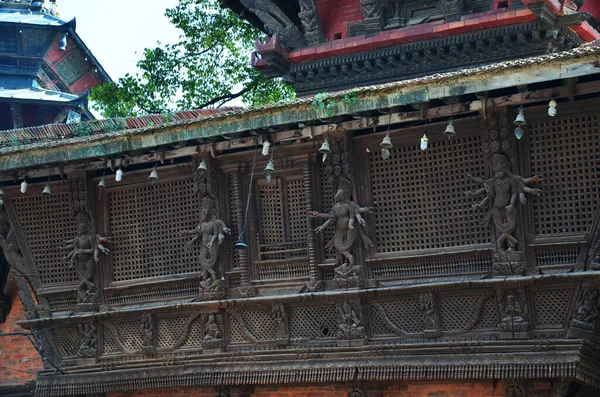 Ancient wood architecture and antique art wooden carved nepalese angel deity god in old ruins building for nepali people foreign travelers travel visit at Basantapur Katmandu city in Kathmandu, Nepal