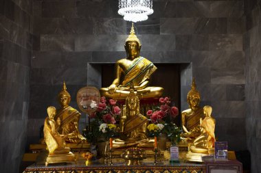 Ancient buddha statue in antique ubosot ordination hall for thai people travel visit respect praying blessing wish mystery in Wat Prodket or Prod ket temple on January 29, 2023 in Nonthaburi, Thailand