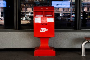 Classic vintage retro red public post box mailbox for Korean people foreign travelers passengers use service send mail letter at Gimhae international airport on February 17, 2023 in Busan, South Korea
