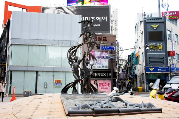 stock image Art sculpture carving modern figure statue symbol on roundabout traffic road for korean travelers travel visit in Nampo dong or Gwangbok dong at Nampodong on February 18, 2023 in Busan, South Korea