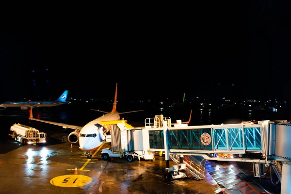 stock image Korean worker people airline ground staff working prepare boeing plane take off flying to sky on runway in night evening time at Jeju International Airport on February 18, 2023 in Jeju do, South Korea