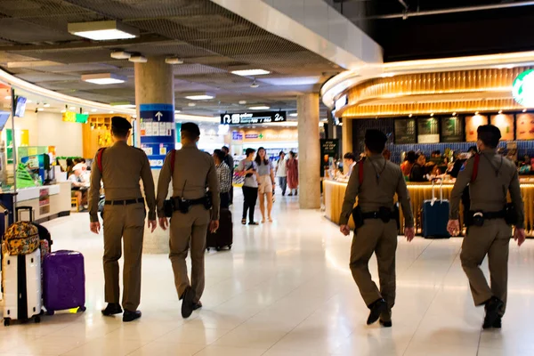 Stock image Security airport policemen guard walking monitor watch out for service passengers travelers and thai people visit travel at Suvarnabhumi International Airport on February 16, 2023 in Bangkok, Thailand