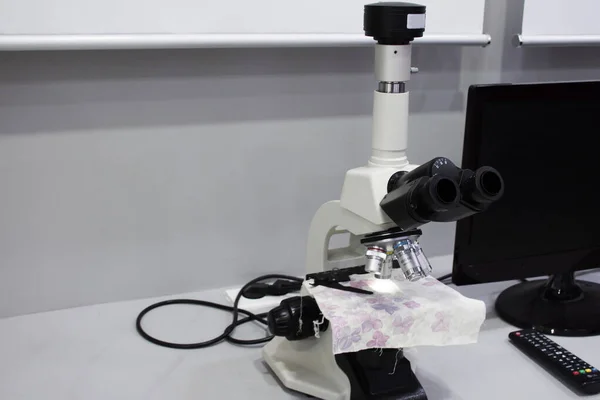 Optical microscope for scientist worker and lab technician use test explore looking small objects in laboratory or lab room of korean at Jeju island in Jeju do, South Korea