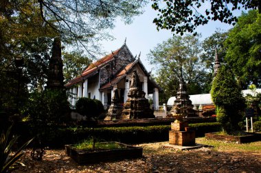 Ancient old ordination hall or antique ruin ubosot for thai travelers people travel visit respect praying blessing buddha wish myth holy worship at Wat Nang Kui Monastery Temple in Ayutthaya, Thailand clipart
