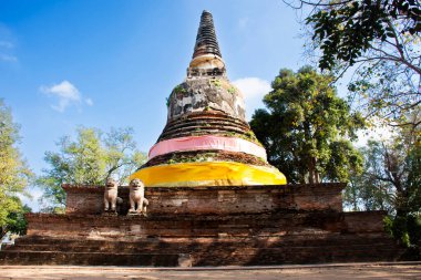 Ancient ruins stupa and antique old ruin pagoda chedi for thai people travelers visit respect praying blessing buddha wish mystical in Wat Mae Nang Pleum or Maenangpluem Temple in Ayutthaya, Thailand clipart