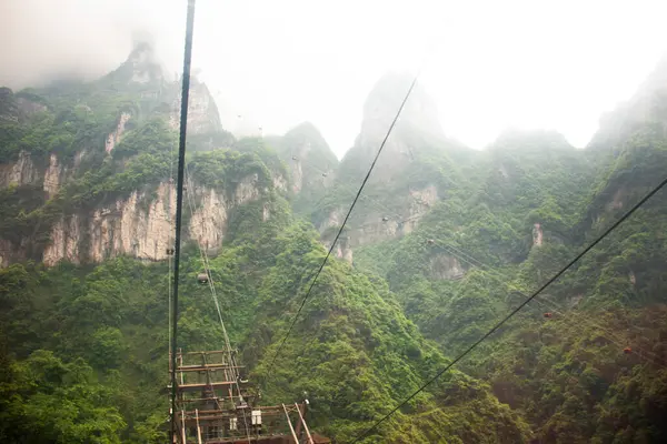 stock image View landscape range mountain and cable car cableway for chinese people foreign traveler travel visit Tianmen cave or Heaven Gate in Tianmen Mountain National Forest Park at Zhangjiajie in Hunan China