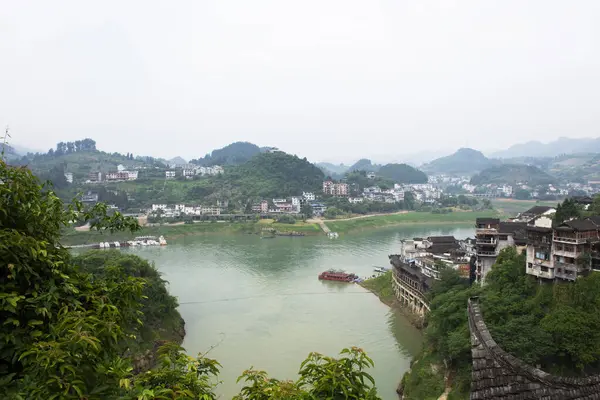 stock image Cityscape historic building or heritage antique architecture of Furong Zhen Tujia ancient town landscape youshui river for chinese traveler travel visit at Yongshun city on May 9, 2024 in Hunan, China