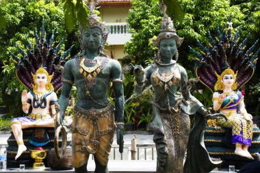 Grandpa Naga Pu Si Suttho and Grandma Naka Si Pathumma with naka guardian of Wat Mai supradittharam temple for thai people visit respect praying blessing at Nakhon Chai Si in Nakhon Pathom, Thailand clipart