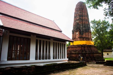 Ancient ruins stupa and antique old ruin pagoda chedi for thai people travelers travel visit respect praying blessing buddha wish mystical in Wat Prang Luang Temple at Bang Yai in Nonthaburi, Thailand clipart