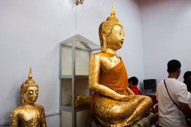 Ancient buddha Luang Por Ban Laem statue for thai people traveler travel visit respect praying blessing wish myth angel deity in Wat Phet Samut Worawihan temple at Amphawa in Samut Songkhram, Thailand clipart