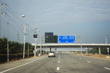 View landscape of highway street and traffic road at intercity motorway routes network m81 bangyai - kanchanaburi and local thai people driving car vehicle on December 26, 2024 at Nonthaburi, Thailand clipart