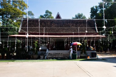 Ancient sanctuary hall or antique pavilion sala din for thai people travel visit respect bless buddha holy worship in Wat Sing or Singh temple at SamKhok on December 30, 2024 in Pathum Thani, Thailand clipart