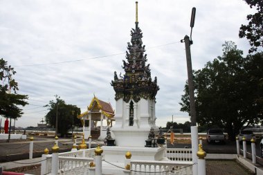 Ancient porcelain glazed tiles stupa chedi mon raman style and antique holy deity angel for thai people travelers travel visit respect blessing in Wat Chedi Thong at Sam Khok in Pathum Thani, Thailand clipart