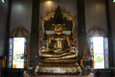 Holy ancient buddha statues Luang Phor Tan Jai for thai people travelers travel visit respect praying blessing wish in Wat Bot antique temple at Sam Khok on December 30, 2024 in Pathum Thani, Thailand clipart