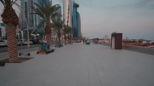 Doha Corniche Sunset Shot Showing West Bay Skyscrapers Promenade Locals — Stockvideo