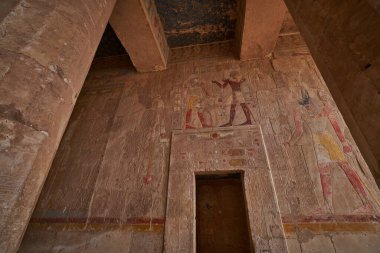 Temple of Hatshepsut, Luxor Egypt showing court-chapel OF ANUBIS with colorful scene of Thutmose III offerings wine to the god Sokar one of the gods of the dead