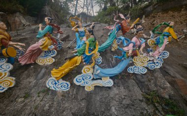 Bridge of Fairies showing smiling faces of the Seven Fairies descending from heaven with grace in The Chin Swee Caves Temple in Pahang,  Malaysia clipart