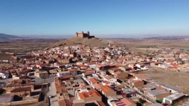 Aerial view of La Calahorra castle, showcasing its Renaissance courtyard, situated near Granada in Andalusia, Spain. This location is featured in the TV series The House of the Dragon, Pentos Castle