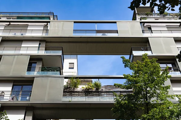 Parisian street houses, windows, balconies and apartment buildings.