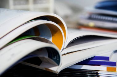 open magazine on wooden table