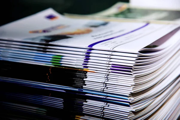 Stacks of magazines on shelves in the library.