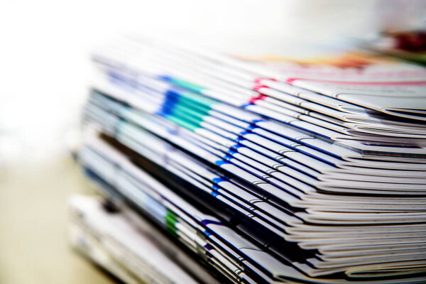 Stack of magazines on white background isolated education concept