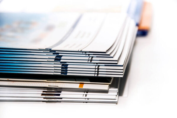 stack of magazines on white background isolated