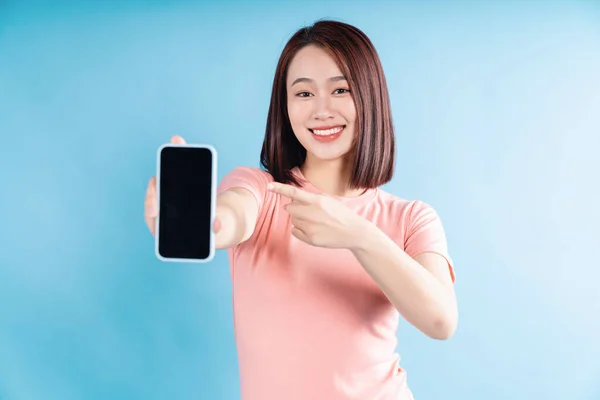 Stock image Asian woman on blue background