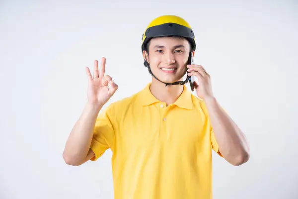 stock image Image of young Asian delivery man on background