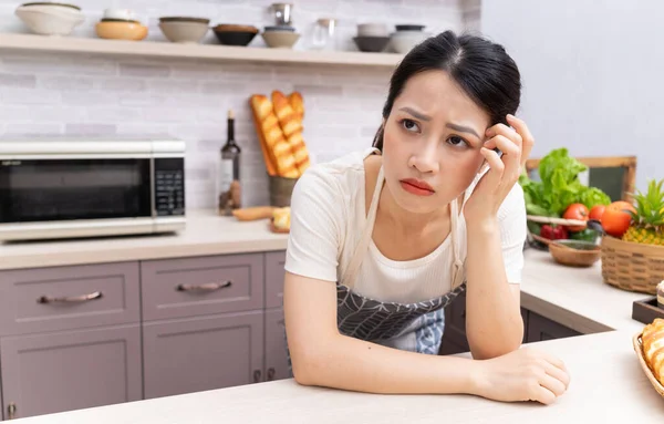 stock image Young Asian woman feeling tired of housework