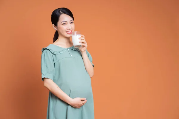 stock image Photo of Asian pregnant woman on background