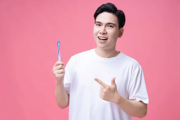 Giovane Asiatico Uomo Holding Spazzolino Denti Sfondo — Foto Stock