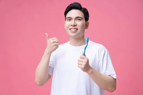 Junger Asiate Mit Zahnbürste Hintergrund — Stockfoto