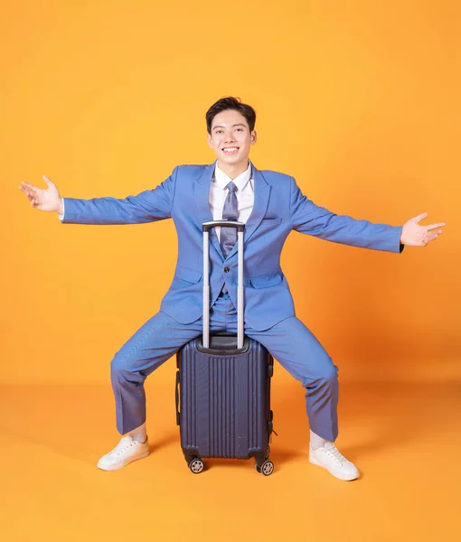 Stock image Image of young Asian business man holding suitcase on background