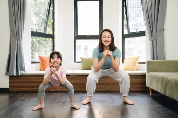 stock image Asian mother and daughter exercise at home