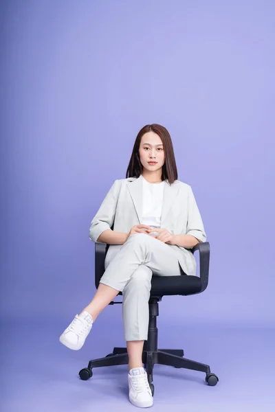 stock image Photo of young Asian businesswoman on background