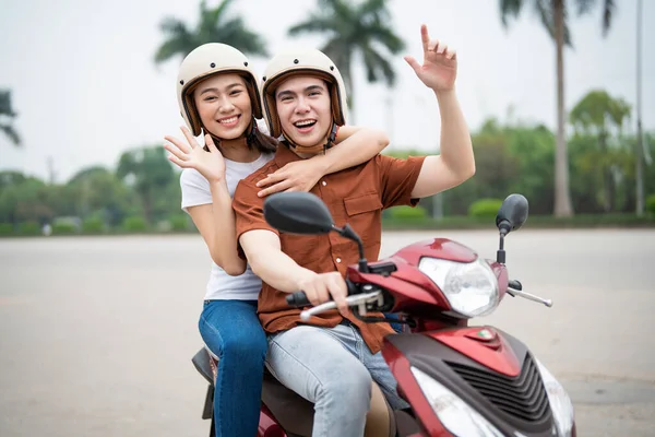 Young Asian Couple Motorbike Royalty Free Stock Images