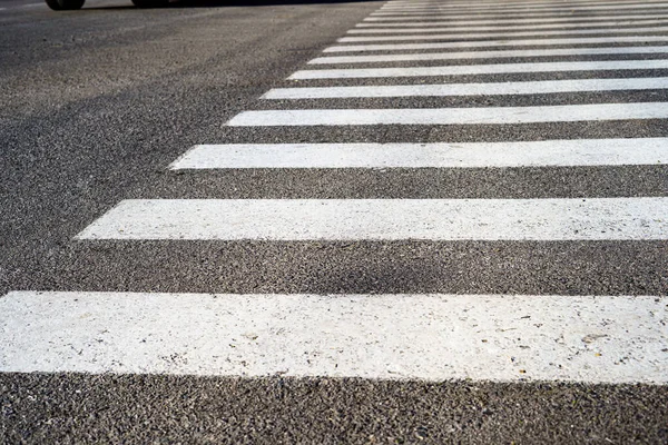 stock image Crosswalk, safety on the road. Crosswalk on a small asphalt road.