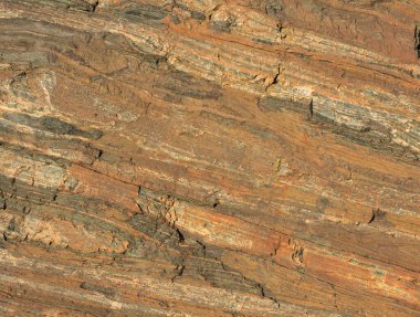 Maden ocağındaki taşın dokusu. Yerden çıkarılan taşın doğal görünüşü.