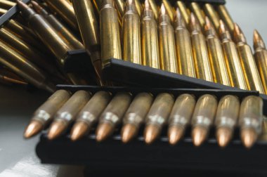 Close-up of ammunition for an assault rifle. Small-caliber ammunition for small arms clipart