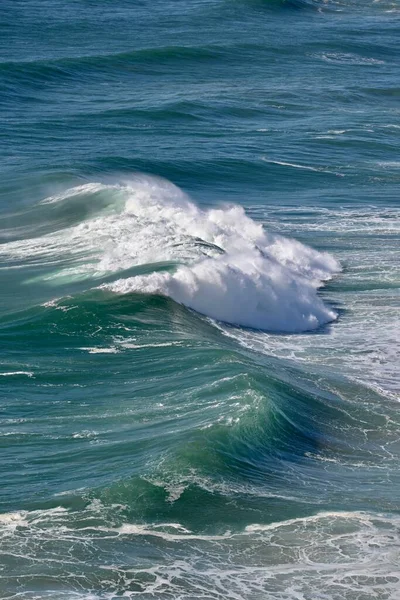 Big ocean wave in windy weather