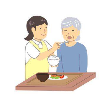 Bakıcı, yaşlı bir insana yemek konusunda yardım ediyor.