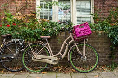 bicycle in front of a brick wall